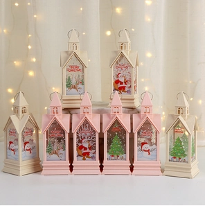 Close-up of pink and beige Christmas lantern with LED lights and Merry Christmas motifs