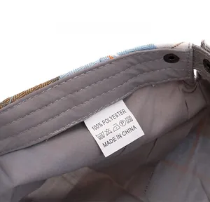 Detailed macro view of the interior lining and 100% polyester care label of the plaid hat