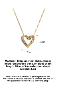 Detail of gold heart pendant necklace showing 1.5cm zircon micro-inlay and steel chain