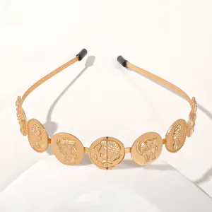 Detail of gold metal headband with embossed coin ornaments showing 2.3cm diameter