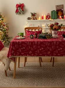 Detailed Christmas table runner with festive tree patterns and gold lace edge