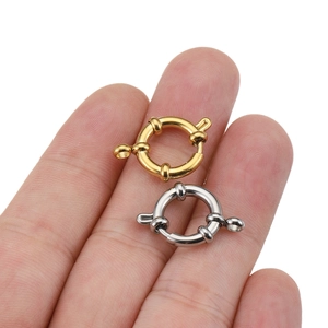 Gold and silver stainless steel sailor spring clasps shown on fingers for size scale