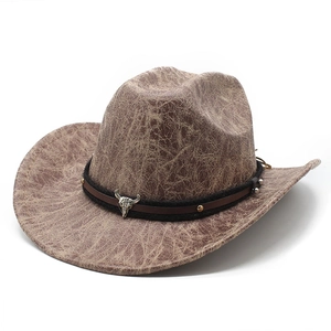 Brown western cowboy hat with cracked leather texture and metal bull skull decoration