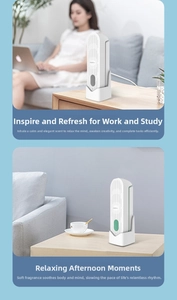 Vertical view of a white smart fragrance diffuser on its charging base for desk or wall