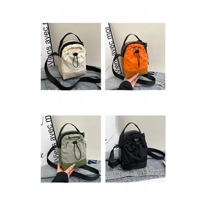 Waterproof drawstring crossbody bags in white, orange, green, and black color options