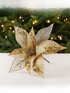 Macro detail of 28cm golden poinsettia with sparkling sequins for Christmas tree decoration