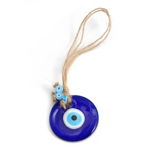 Close-up of glass Evil Eye charm with blue beads and traditional rope keychain