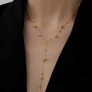 18K gold plated stainless steel Y-necklace with long bead tassels on female model