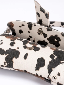 Women's animal print canvas shoulder bag with magnetic snap button closure detail