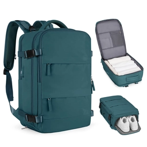 Teal waterproof travel backpack featuring large capacity compartments and a separate shoe pocket