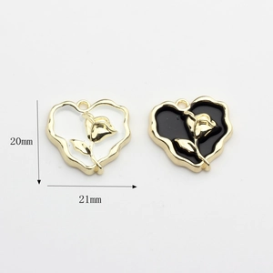Golden heart pendants with black and white enamel rose detail for DIY jewelry making