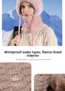Detail of windproof pink knit exterior and warm fleece lining on a hooded winter scarf hat