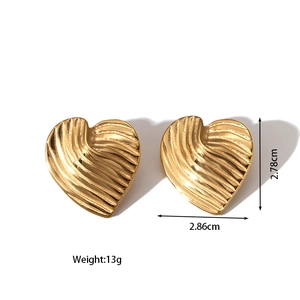 Detail view of 18k gold plated heart earrings showing wavy texture and dimensions
