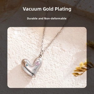 Detail of heart necklace with colorful zircon inlay and silver vacuum plated finish