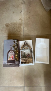Detailed view of the Christmas water lamp packaging and secure protective foam inserts