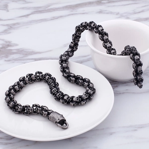 Close-up of vintage punk skull link chain bracelet in oxidized stainless steel
