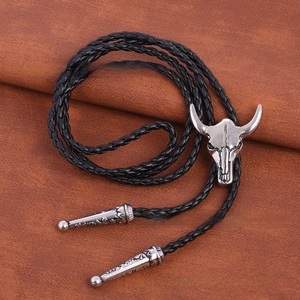 Detailed close-up of a silver ox head bolo tie pendant with retro cowboy style