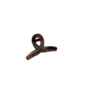 Mini tortoiseshell resin hair claw clip with cross-wrap design for fine hair on white background