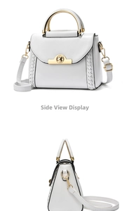 Detail view of white leather handbag with gold metal handle and woven texture side panels
