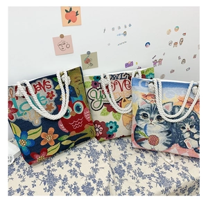 Three assorted woven canvas tote bags with animal patterns and sturdy cotton rope handles