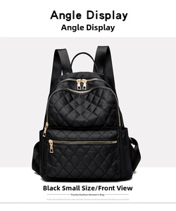 Front detail of small black quilted nylon backpack with gold zippers and compartments