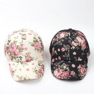 Floral print baseball caps in beige and black with vintage pink rose patterns