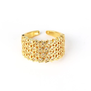 Detail of gold-plated multi-layer open ring featuring micro-pasted star patterns with crystals