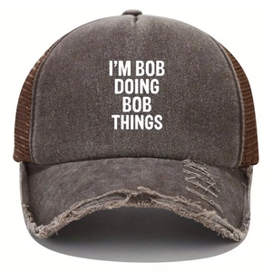Close-up of distressed brim and mesh detail on a vintage brown trucker baseball cap