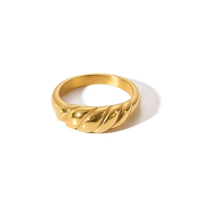 Detailed close-up of 18k gold plated stainless steel croissant ring with twisted texture