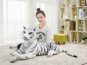 Close-up of realistic white tiger plush shell with detailed blue eyes and soft faux fur