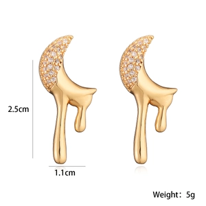 Detailed view of gold plated star moon earrings with dimensions 2.5cm and 5g weight