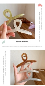 Detail showing translucent acrylic hair claws with metal spring and cross-twist design