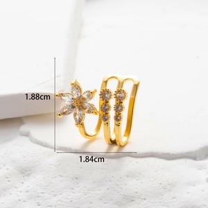 Detailed view of a gold flower ear cuff with micro-paved zircons and size dimensions