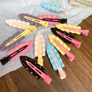 Group of colorful wave-shaped duckbill hair clips in various vibrant macaron shades