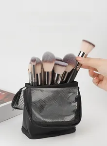 Vertical makeup brush travel bag with foldable stand design and black mesh pockets