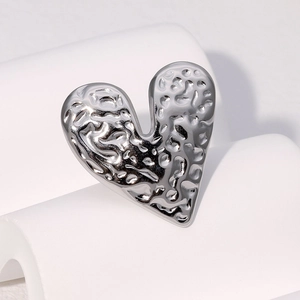 Vintage silver heart-shaped stainless steel ring with a unique irregular hammered texture