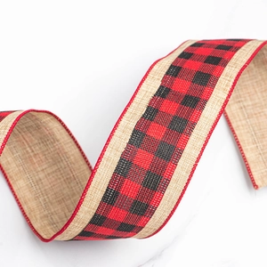 Detail of red and black buffalo plaid faux linen ribbon with wire edges for Christmas bows