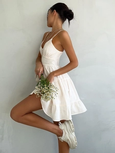 White V-neck cotton tiered sundress with high waist and spaghetti straps in summer style