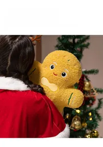 Detail of plush gingerbread man toy with curly fleece texture and festive embroidery