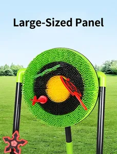 Outdoor target game set with colorful darts and toy axes on a green lawn landscape