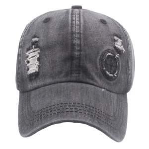 Distressed dark gray washed denim baseball cap with vintage frayed holes and curved brim