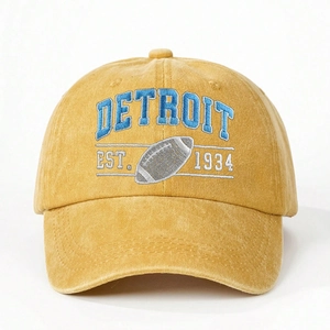 Ginger washed canvas baseball cap featuring blue Detroit embroidery and football motif