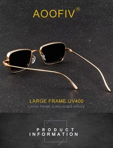 Detail of square gold metal sunglasses with UV400 large frame on mineral background