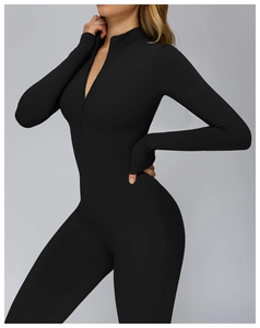 Close-up of black thermal long sleeve bodysuit with stand collar and front zipper detail