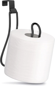 Detail of black wall-mounted metal toilet paper holder hanging on cabinet door