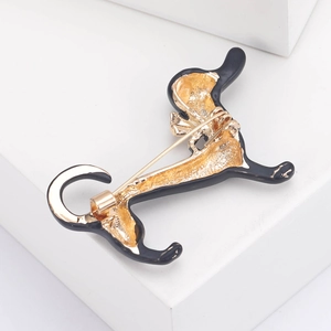 Creative enamel dachshund dog brooch with gold metal backing and secure pin clasp