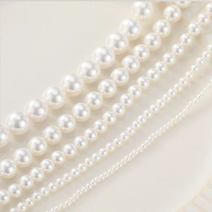 Strands of round white natural shell pearls for handmade jewelry and necklace DIY
