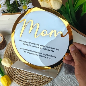 Detail view of round acrylic Mother's Day plaque with gold mirror border and Mom poem