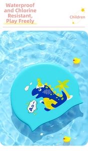 Detail of blue silicone kids swim cap with cartoon dinosaur on rippling water