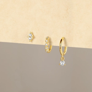 Macro detail of S925 silver earring set with zircons and 18K gold plating